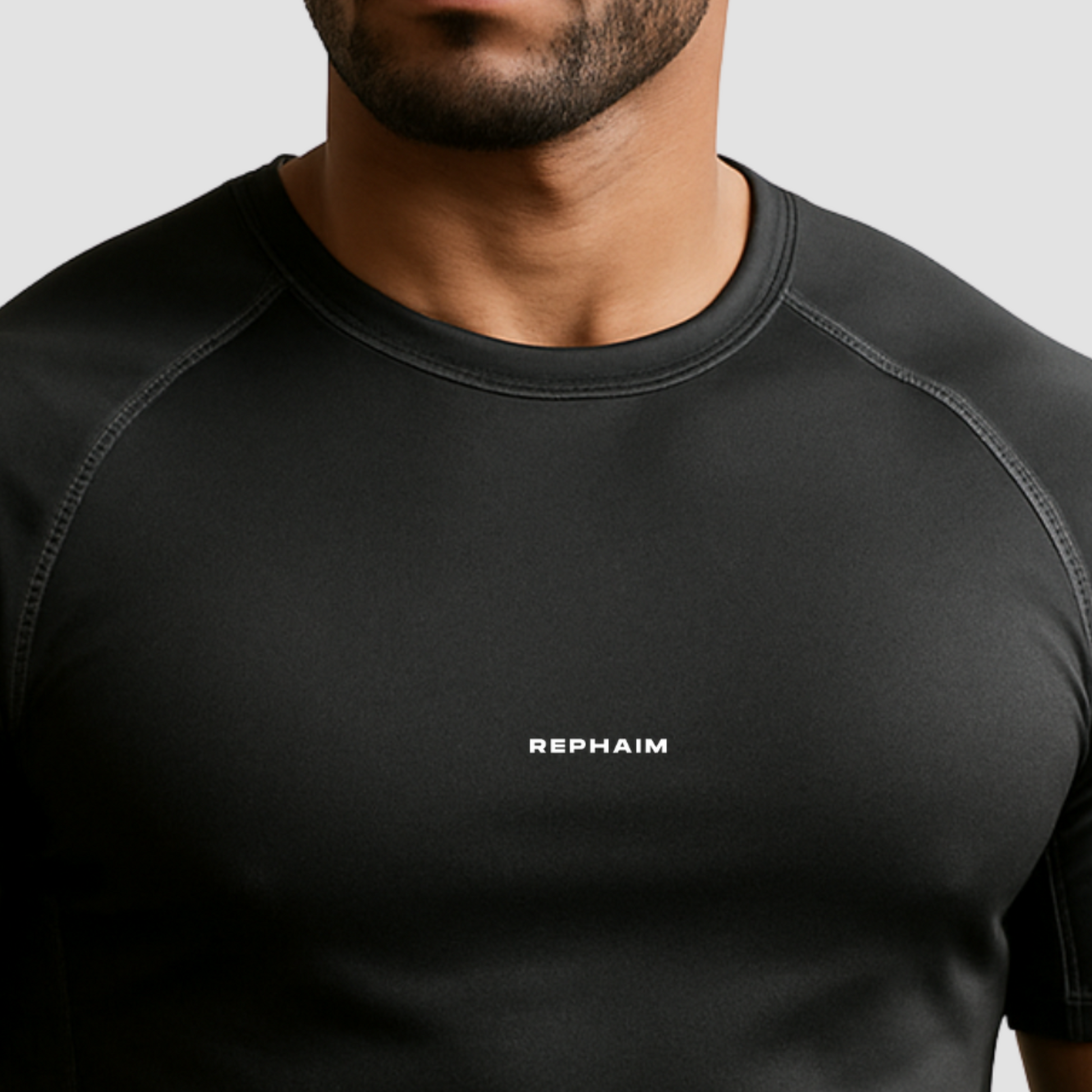 Men’s gym t-shirt India, compression fit black polyester spandex blend, chest logo front side