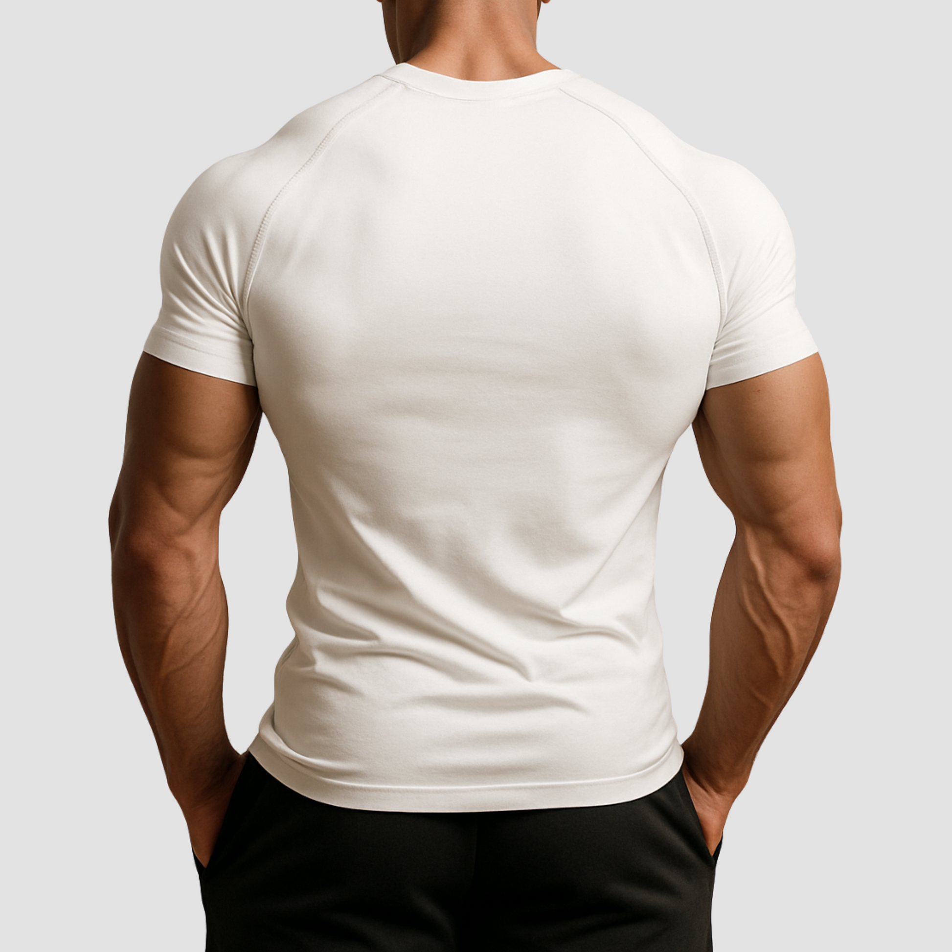 Full back view of men’s white compression t-shirt, durable poly-spandex gym top with muscle-contouring fit.
