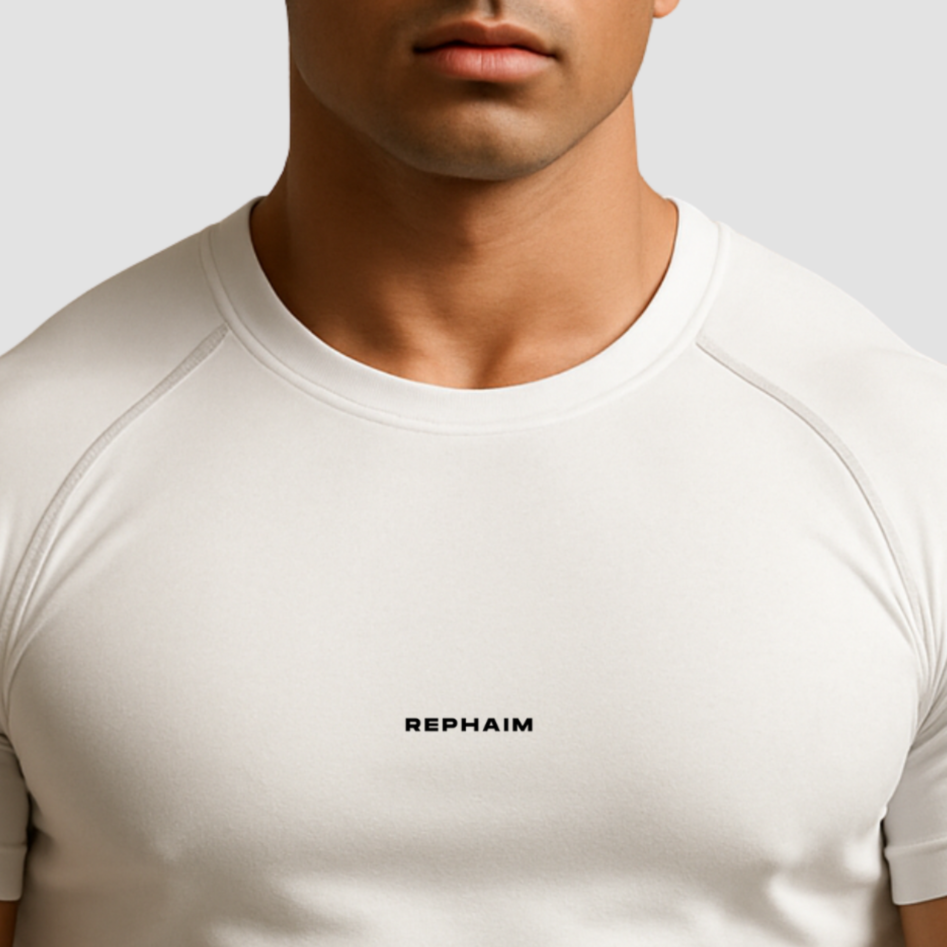 Athletic model wearing white compression t-shirt for men, premium performance gym wear with muscle-enhancing fit.