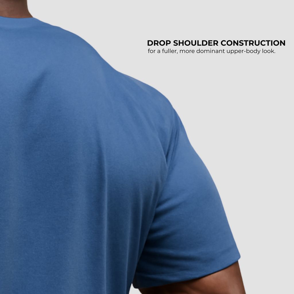 Oversized men’s gym t-shirt India in navy blue cotton, drop shoulder construction for fuller athletic fit.